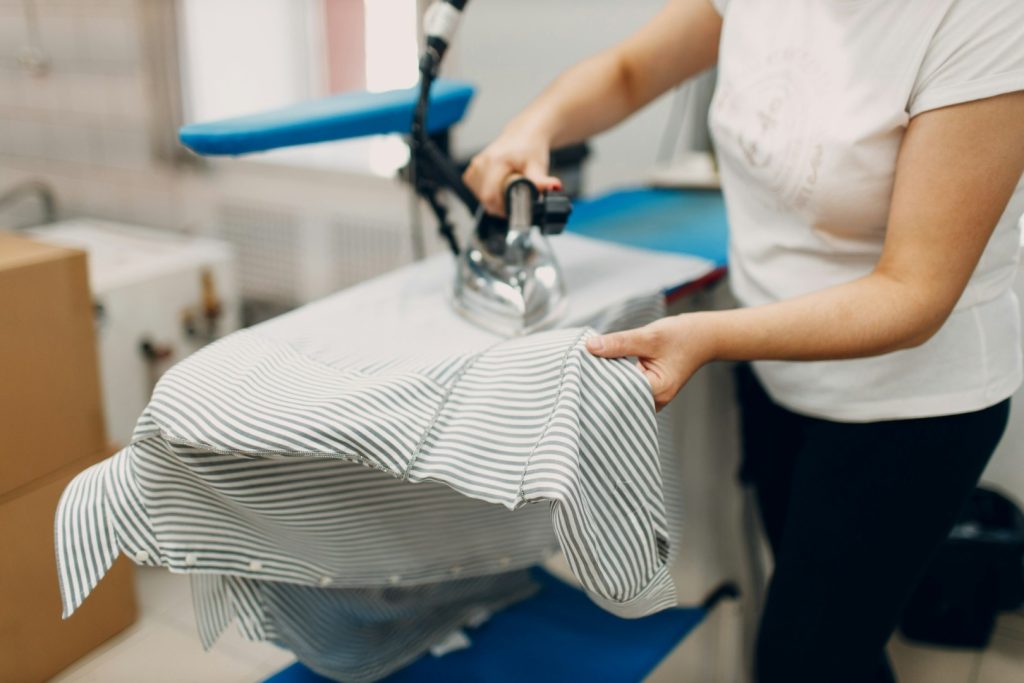 Dry cleaning clothes. Clean cloth chemical process. Laundry industrial dry-cleaning